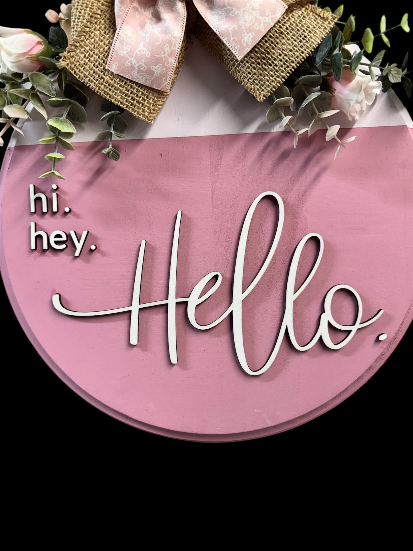 Hand-painted 12” Hi, Hey, Hello Door Round in pink with roses and eucalyptus, perfect for welcoming guests.
