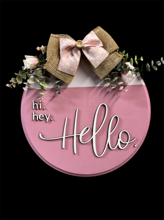 Charming Hi, Hey, Hello Door Round, 12” pink with eucalyptus and roses, perfect for welcoming guests.